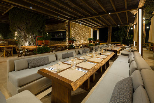 NAO Pool Club is a New Concept: Pool Club & Restaurant in Puerto Banus surrounded by nature . Tables in restaurant area.