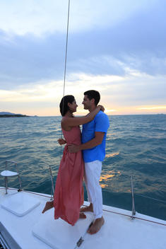 Couple relaxing on catamaran