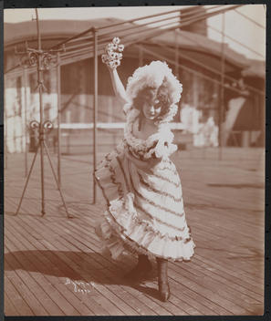 An Actress In Costume Rehearsing On The Roof Of What Is Probably The New York Theatre.