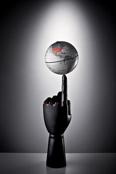 Globe Balancing On Finger Tip