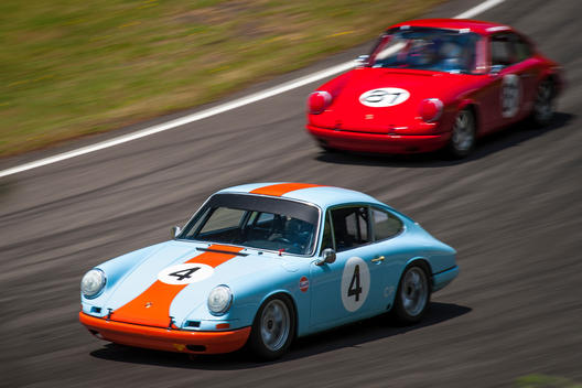 Porsche 911 race cars compete in the 2013 Pacific Northwest Historics automobile racing event.