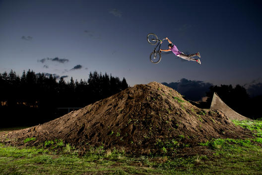 A young man performs dirt jumps near Toluca, Mexico