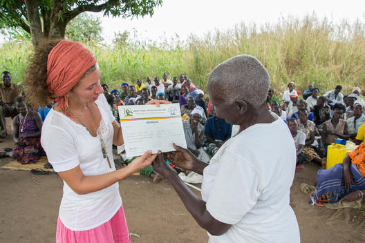 graduation ceremony for over 200 students from CAFWA\'s (Community Action Fund for Women in Africa) adult literacy centers in Omel and Cwero. All students passed the national adult literacy exam. Ceremony attended by CAFWA director Linda Eckerbom Cole