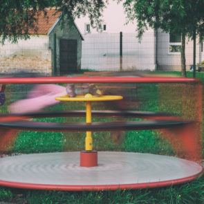 Kids On Children’s Playground Carousel