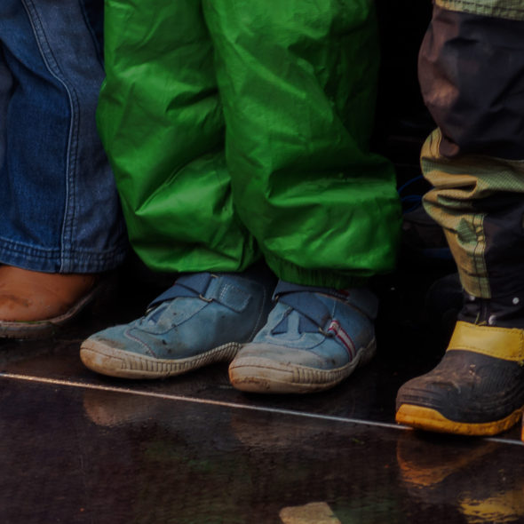 Three children standing – shoes and feet