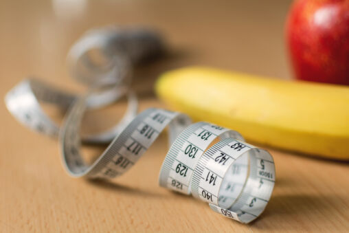 Measuring tape and fruits
