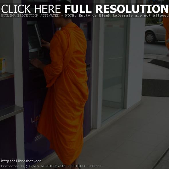 Buddhist monk and ATM