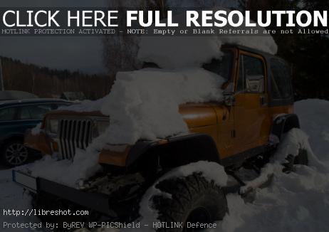 Off Road Jeep Car Covered With Snow