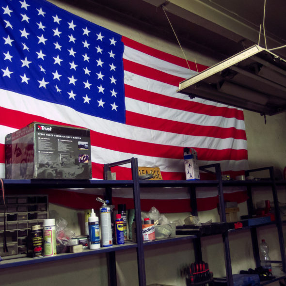 American Flag On The Wall Of Car Repair Shop
