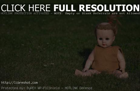 Free image of Vintage doll on the grass