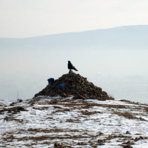 Mongolian ovoo and raven