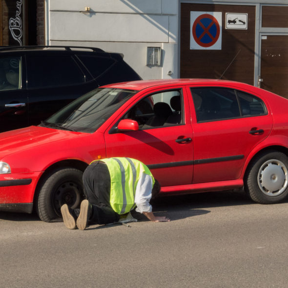 Man changing the punctured tyre
