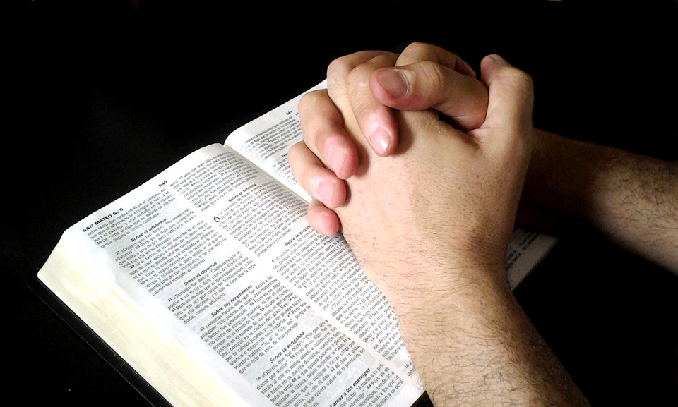 interlocking hands, prayer, bible