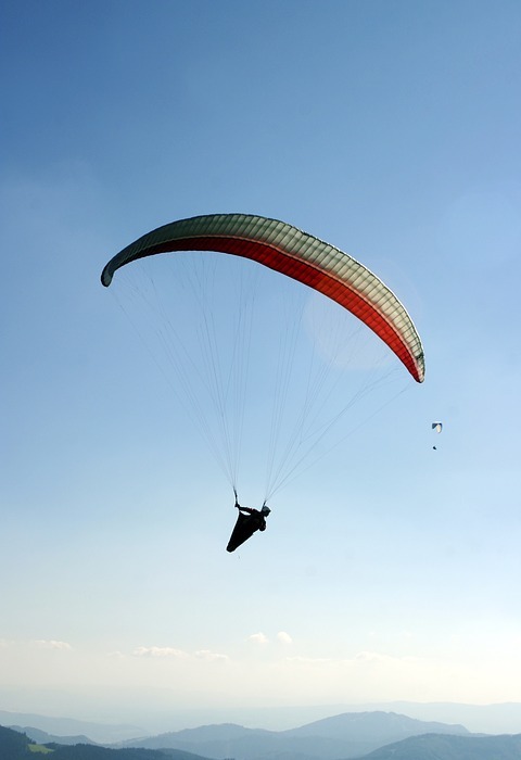 paragliding, a parachute, the sky
