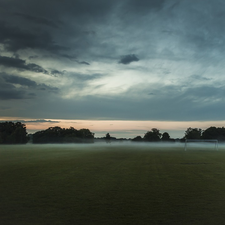 soccer field, foggy, sunrise