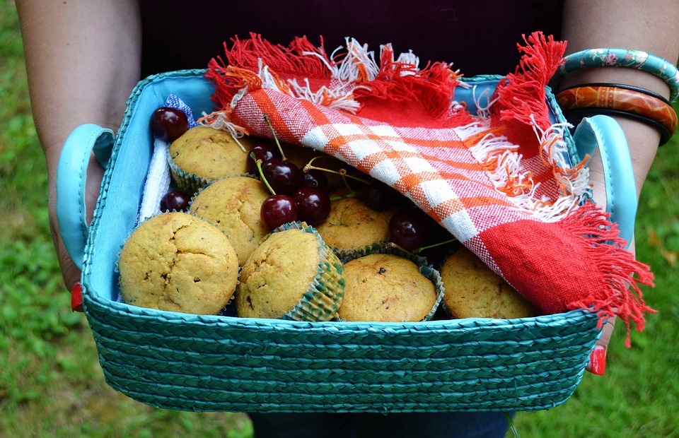 muffins basket, hands holding food basket, muffins
