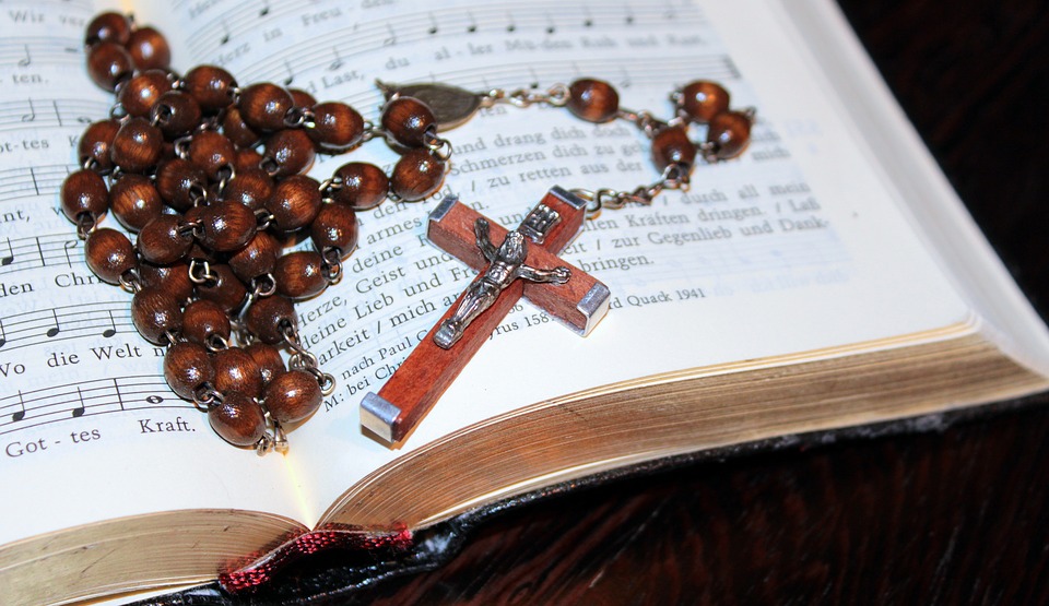 cross, rosary, prayer book