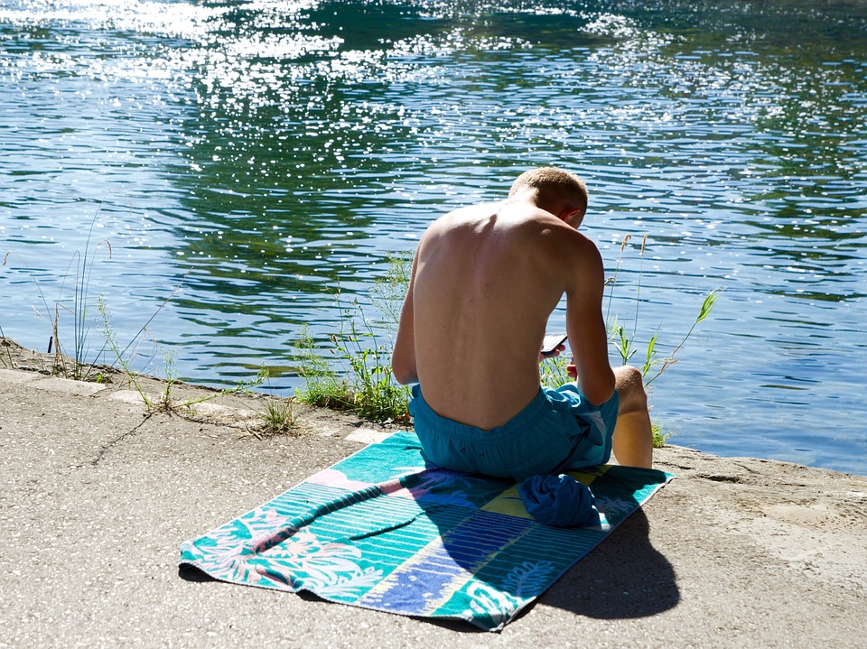 swimming trunks, bath towel, on the water