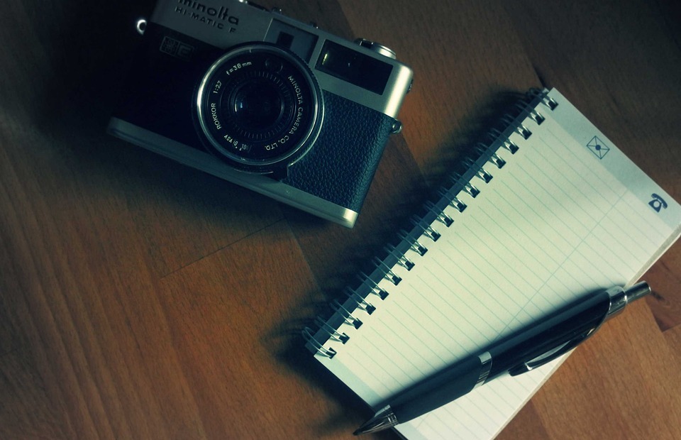 camera, notepad, pen