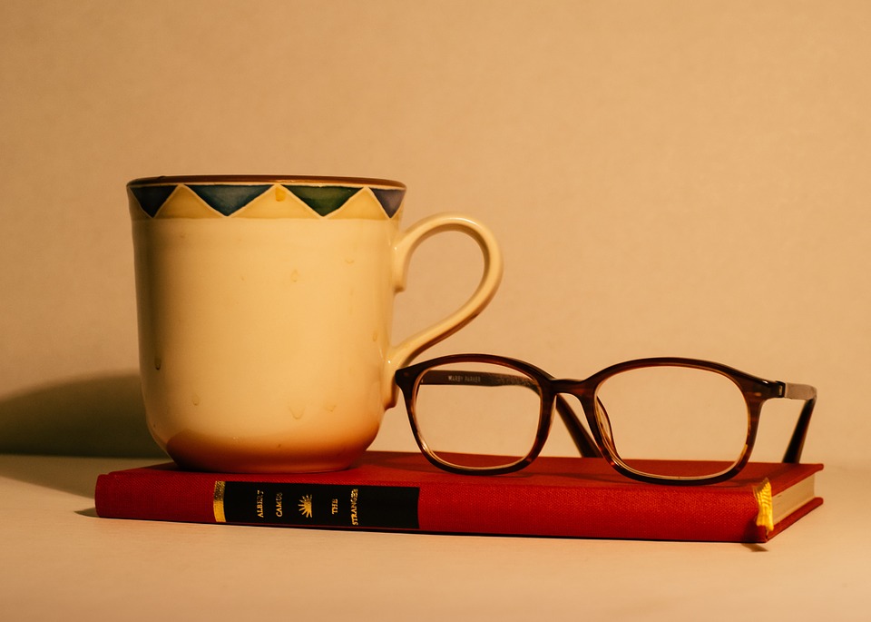 book, eyeglasses, mug