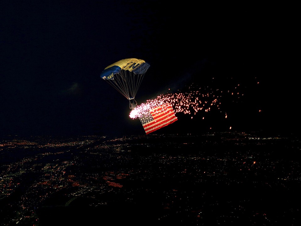 parachutist, flag, fireworks