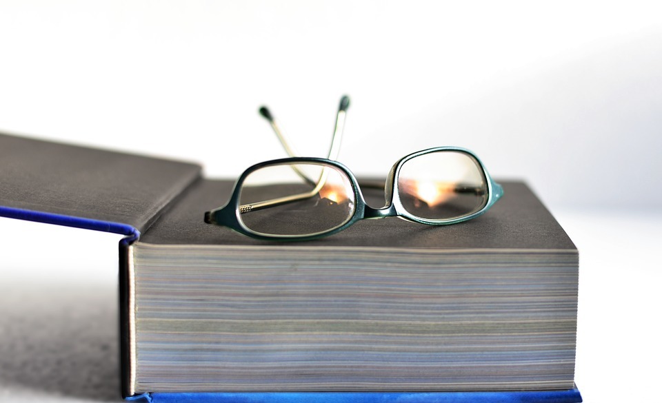 book, glasses, pitched