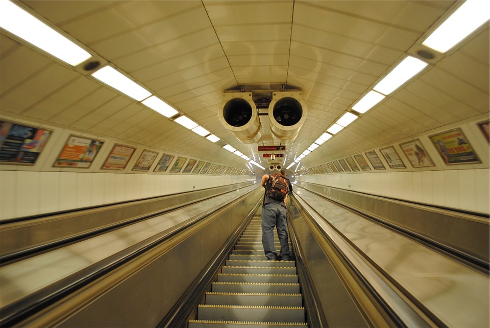 escalator, subway station, guy