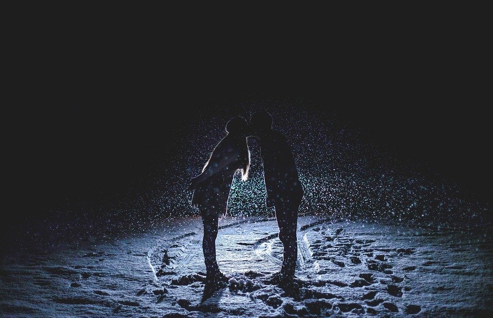 couple kissing, snowy night, snowing