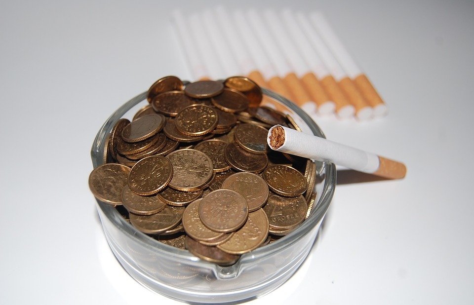 cigarettes, ashtray, money