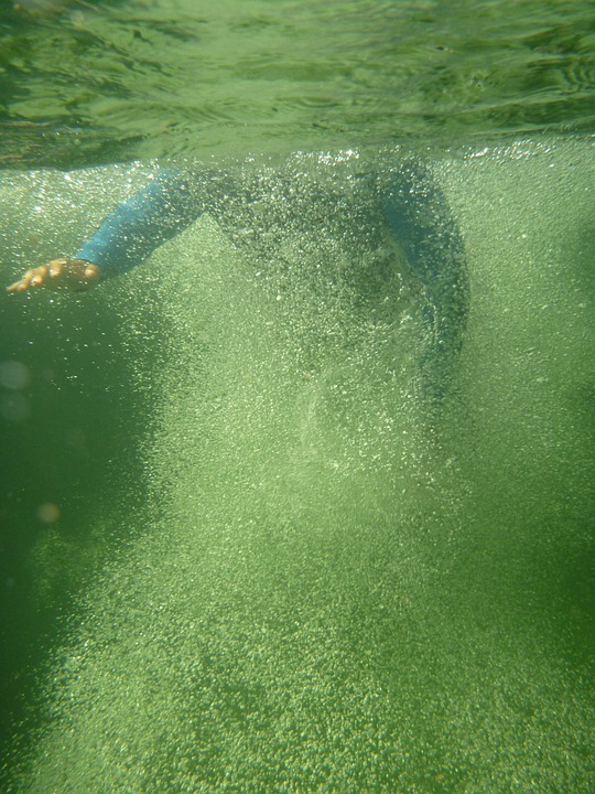 beautiful woman bathe underwater in tropical sea