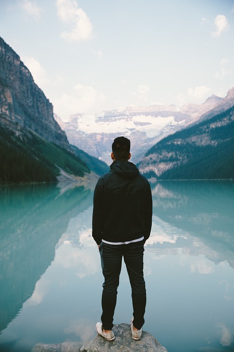 person, standing, mountains