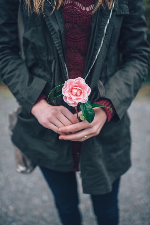 woman, holding, flower
